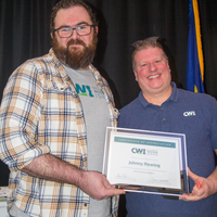 Winners hold their certificates at a faculty professional development event.