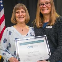 Winners hold their certificates at a faculty professional development event.