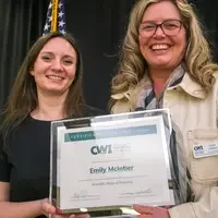 Winners hold their certificates at a faculty professional development event.