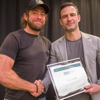 Winners hold their certificates at a faculty professional development event.
