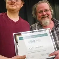 Winners hold their certificates at a faculty professional development event.