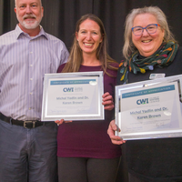 Winners hold their certificates at a faculty professional development event.