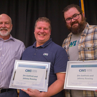 Winners hold their certificates at a faculty professional development event.