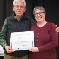 Winners hold their certificates at a faculty professional development event.
