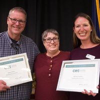Winners hold their certificates at a faculty professional development event.