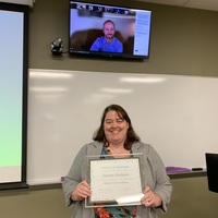 Jaren Watson receiving an award