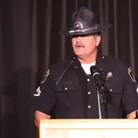 Sergeant Jim Love of the Idaho State Police Department addressing graduates