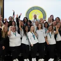 Group of graduates and faculty cheering