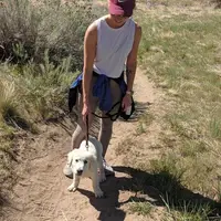 April 21-day challenge participant, Maggie Saye, hiking with her dog, Murphy.