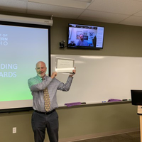 Mike Robinson receiving an award