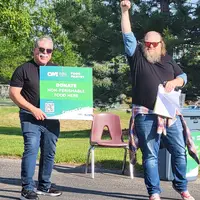 Concert volunteer Stephen Quintero and Christian Lybrook