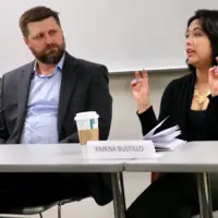 Panel of media professionals speak to students.