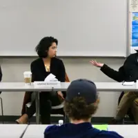 Panel of media professionals speak to students.