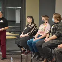 LGBTQ+ Panel Discussion panelists and moderator