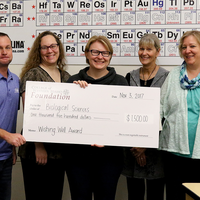 Science Faculty with wishing well check