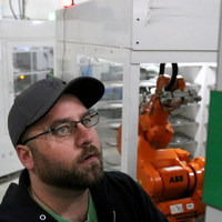 Dan Thompson works on a CNC machine at Rekluse Motor Sports on Sept. 27, 2017.