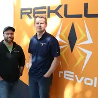 CNC programmer Dan Thompson, left, poses for a photo with Sean Brown, President of Rekluse Motor Sports in Boise. Thompson, a CWI graduate, has been working at the company for the past year.