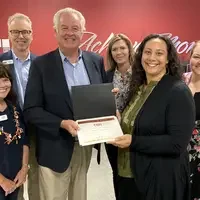 Staff of the Month recipient, Alexis Malepeai-Rhodes, poses with CWI Board of Trustees on Oct. 15.