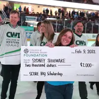 SCORE Big Scholarship recipient, Sydney Shoemake, showing off her big check