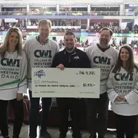 Senior Account Executive, Steven Anderson, presents SCORE Big Scholarship funds to CWI leadership