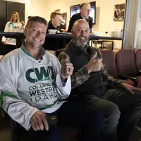 CWI Foundation Board members, Ben Chaney and Mike Peña, enjoying the game from the CWI suite