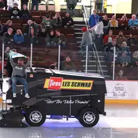 Enrollment Counselor, Jared Lopez, riding on the Zamboni