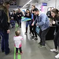 CWI Enrollment Team dancing with a fan