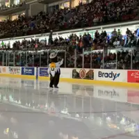 Blue, the Idaho Steelheads mascot, sporting a CWI backpack
