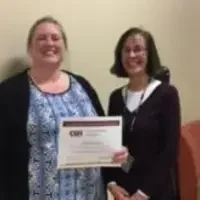 Tiffany Gamel with her scholarship