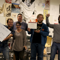 Art Faculty and students with wishing well check