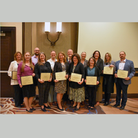 Dean Justin Vance standing with a group of fellow award receipients