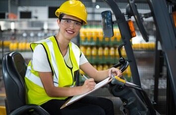 Student learning to drive a forklift