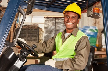 Student learning how to drive a forklift