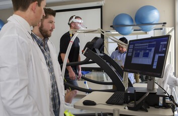 People in exercise lab looking at computer screen