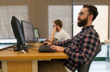 Software Development students at computers in a classroom