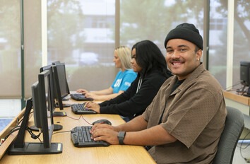 CWI students in the Administrative Specialist program learning at computers