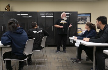 Law enforcement instructor teaching a group of students in the classroom