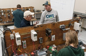 CWI students working with electrical equipment