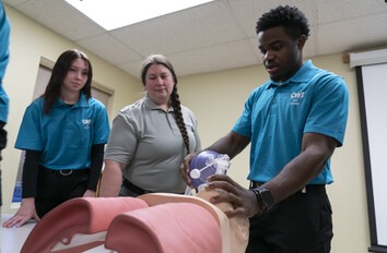 CWI student learning how learning how to help a patient breath