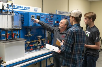CWI students and instructor at a process control system