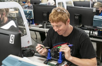 CWI student using electronics equipment