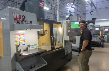 Machine Tool student working with the CNC equipment