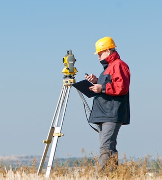 Person outside with equipment and clipboard