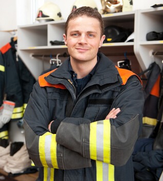 Person standing in firefighter gear
