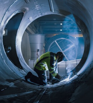 Welder working in tunnel