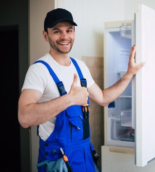 Repair man working on refrigerator