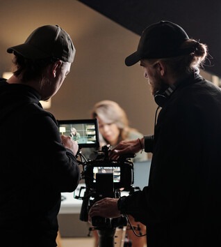 Videographers recording in a studio