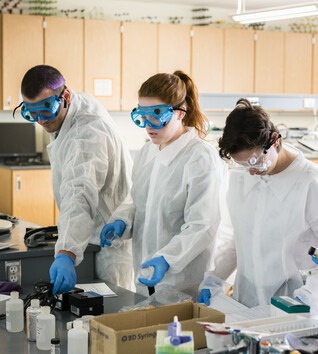 STEM instructor teaching students in a lab