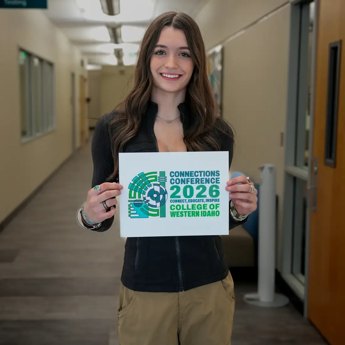 Ayla Taylor holding Connections Conference logo