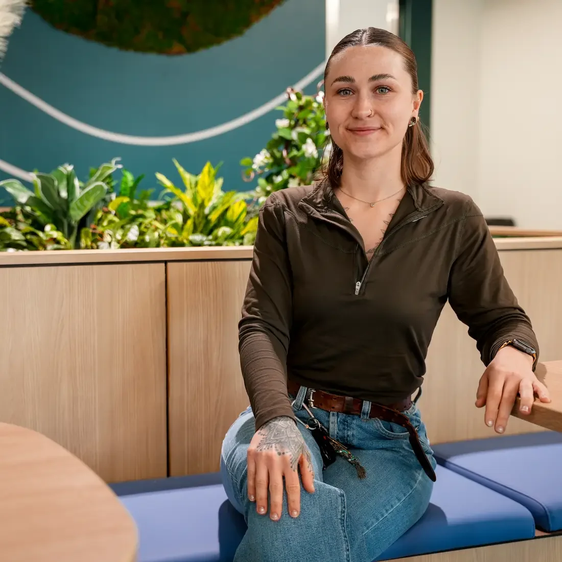 ShanDale Youmans sitting near plant box